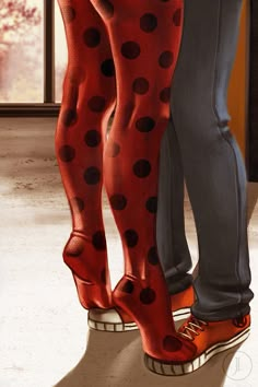 the legs and feet of two people wearing red polka dot stockings, standing next to each other