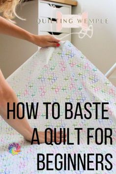 a woman is sewing on a quilt with the words how to base a quilt for beginners