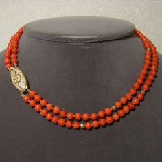 "A refined classic! This double strand \"Floral and Coral\" choker necklace is made from round 5.5mm natural color red vintage Italian coral beads, scarce and valuable- with the added attraction of a very substantial 18K yellow gold and diamond oval centerpiece clasp, which is perfect worn in front or off to one side. The clasp isn't marked, but the weight and beautiful workmanship suggest Italian manufacture. Length is approximately 16\", total diamond weight is 0.63 ct. If you'd like to see a Coral Choker, Necklace With Diamond, Coral And Gold, Red Vintage, Coral Beads, Nice Things, Oval Diamond, Vintage Italian, Custom Rings