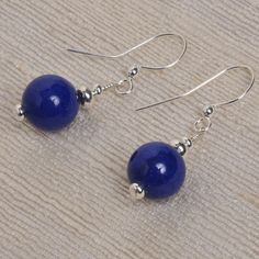 "A beautiful blue color. These earrings are made of a stone named aventurine. They are very light weight. The earring measures 10 x 35 mm (3/8\" x 1 1/2\") from the top of the wire. The dangle is 10 x 22 mm (3/8\" x 7/8\")." Blue Round Earrings With Gemstone Beads, Blue Sterling Silver Earrings With Gemstone Beads, Blue Lapis Lazuli Earrings, Blue Natural Stone Earrings As Gift, Blue Round Bead Sterling Silver Earrings, Blue Sterling Silver Round Bead Earrings, Blue Sterling Silver Earrings With Round Beads, Blue Gemstone Bead Drop Earrings, Blue Gemstone Beads Drop Earrings