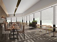 an empty restaurant with tables and chairs next to the windows covered in blind shades that are open