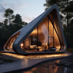 an unusual house in the woods is lit up at night