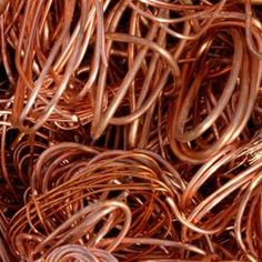 many copper colored wires are piled together