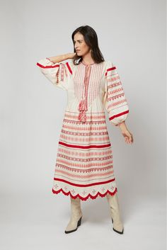 With its feminine shape and exquisite embroidery and details by Larkin Lane, the Kateryna dress from Ukraine is a "one decision" outfit that speaks volumes about your style. The beauty of this textile tradition takes center-stage and can be paired with simple accessories, wedges, boots, or sandals. Versatile enough to go from sightseeing to celebrations; and did we mention... she has pockets?? Embroidery is a fundamental part of the Ukrainian folk art tradition dating back to the 5th century. La Resham Embroidery Midi Dresses, Spring Off-white Dress With Resham Embroidery, Spring Off White Dresses With Resham Embroidery, Festive Off-white Dress With Floral Embroidery, Festive Off-white Floral Embroidered Dress, Festive Off White Floral Embroidery Dress, Red Maxi Dress With Intricate Embroidery, Festive Long Sleeve Embroidered Midi Dress, Red Embroidered Maxi Length Dress