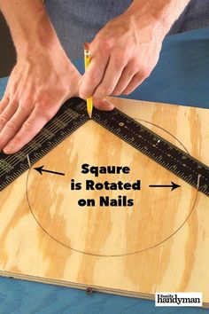 a person is measuring the height of a square with a ruler on top of it