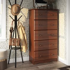 a hat and coat rack in the corner of a room