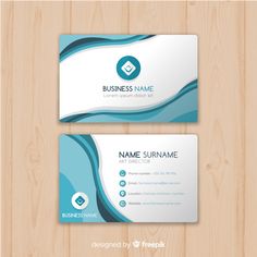 two business cards with blue and white waves on wooden background, front and back side