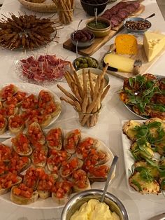 a table topped with lots of different types of food