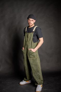 High quality cotton olive green denim baggy overall for men & women, heavy weight durable cotton fabric, although breathable and comfortable to wear all day. Wear it at work or even as your street wear clothes, cause it's fashionable and stylishly designed for your social life as well! -Four pockets total, functional and roomy enough to fit small tools, keys, even your mobile phone. Two front and two back pockets. -Metal bronze studs and dungaree metal clip fasteners. -Adjustable cotton beige st Utility Cotton Overalls For Outdoor, Cotton Bib Front Overalls For Outdoor, Khaki Cotton Utility Overalls, Green Relaxed Fit Overalls With Pockets, Green Relaxed Fit Overalls, Cotton Utility Overalls With Bib Front, Relaxed Fit Cotton Utility Overalls, Utility Cotton Overalls With Bib Front, Baggy Cotton Overalls With Side Pockets