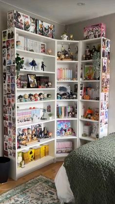 a white book shelf filled with lots of books