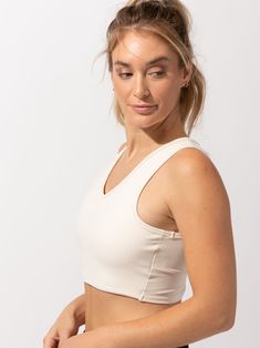 The cutest crop around! The Maliha Twist-Back Crop Top sports a fashionable twist-back detail, while working as a sports bra & active top all in one. This Bra does not have built in pads. Casual Crop Top With Built-in Bra For Pilates, Versatile Activewear Crop Top With Built-in Bra, Beige Sporty Activewear With Built-in Bra, White Crop Top Sports Bra With Built-in Bra, White Crop Top Sports Bra With Built-in Support, White Bra-friendly Athleisure Crop Top, White Athleisure Crop Top Bra-friendly, White Seamless Cropped Activewear, White Cropped Seamless Activewear