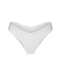 Experience French-inspired charm with the White Saint Remy Bottoms. Featuring dainty bows and scalloped edging, these bottoms are not only cute but also incredibly flattering. The Brazilian cut ensures a perfect fit that hugs your curves just right. Pair the Wavy Saint Remy Bottoms with our White Saint Remy Top, White Firenze Top or White Ambra Top for a coordinated look. Or add some flair with the matching White Wavy Sorrento Sarong. Chic White Seamless Bottoms, Chic Seamless White Bottoms, White Seamless String Bottoms, Feminine Seamless String Bottoms, Elegant String Bottoms For Summer, Feminine Seamless Summer Bottoms, Elegant String Fitted Bottoms, Elegant Seamless Summer Bottoms, Elegant String Beach Bottoms