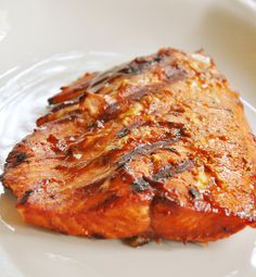 a piece of meat sitting on top of a white plate