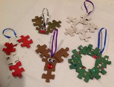 four christmas ornaments are arranged on a table