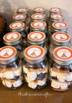 mason jars filled with marshmallows and other things to make campfire gifts