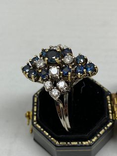 "14Kt White and Yellow Gold Diamond and Blue Sapphire Ring with a Professional 3900.00 appraisal. Ring size 9 1/2. Exact age unknown. This ring has been professionally appraised for $3900.00 and that written appraisal will accompany the ring when sold. Since I am not an expert regarding this item, I have relied on the expertise of the certified professional appraisal. The details about this ring are from a Certified Gemmologist-Certified Gold Smith appraisal and is shown in two of the pictures. Vintage Blue Sapphire Ring With Diamond Accents, Antique Blue Diamond Ring For Formal Occasions, Vintage Blue Brilliant Cut Cluster Ring, Vintage Blue Cluster Ring With Brilliant Cut, Blue Cluster Ring For Formal Occasions, Formal Blue Cluster Ring, Antique Blue Sapphire Diamond Ring, Antique Blue Brilliant Cut Ring, Antique Blue Rings With Brilliant Cut