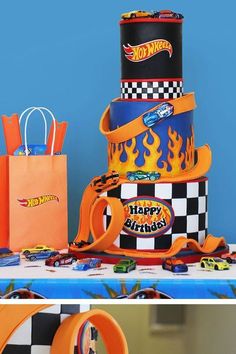 a birthday cake made to look like cars and flames on the top is for a hot wheels theme