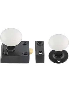 two black and white knobs with one light on each side, the other off