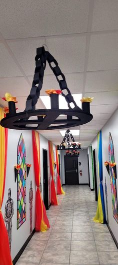 the hallway is decorated with colorful flags and decorations