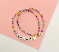 This fun and colourful personalized beaded necklace is a chic detail to your everyday style or as a gift to a loved one. Layer it up with more necklaces for a rich look or wear it alone for a clean and chic style. 🔸 CHOOSE YOUR LETTERS If you want a different word, please write this in the message to seller box when you check out. If you want a personalized necklace in different colours or other changes made, please send me a message. I'm happy to make a special piece for you. SPECIFICATIONS: M Trendy Name Necklace For Mother's Day, Trendy Everyday Customizable Necklaces, Trendy Birthday Necklace With Letter Beads, Trendy Personalized Beaded Necklaces For Gifts, Trendy Beaded Necklace For Gift, Trendy Beaded Jewelry For Birthday, Trendy Beaded Jewelry For Birthdays, Trendy Letter Beads Jewelry For Birthday, Playful Beaded Letter Beads Necklace For Gift