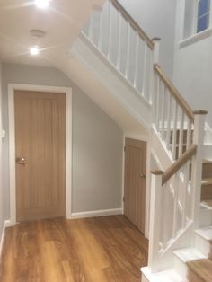 Oak banisters and oak doors White And Oak Staircase, Oak And White Staircase, Stair Banister Makeover, Hallway Uk, Door Under Stairs, Birmingham House, Attic Stair