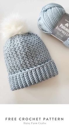 a knitted hat with a white pom - pom on top and the text free crochet pattern