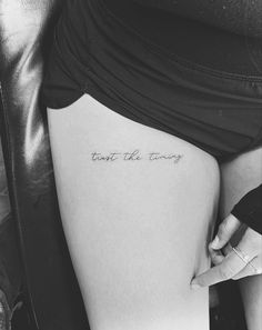 a woman's thigh with the words trust the wrong written on her lower leg