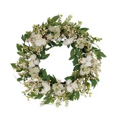 a wreath with white flowers and green leaves