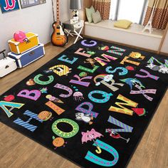 a black rug with colorful letters and numbers on it in a child's room