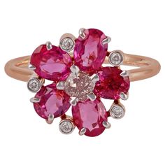 This is an exclusive ring studded in 18k rose gold with 5 pieces of oval shaped ruby weight 2.97 carat with 1 piece of pink diamond in the center weight 0.29 carat & 5 pieces of round shaped diamond weight 0.04 carat, this entire ring is studded in 18k rose gold weight 3.45 grams, this ring has an unique combination of ruby & pink diamond, ring size can be change as per the requirement. Pink Diamond Ring, Gold For Sale, Ruby Rose, Pink Diamond, Cluster Ring, 18k Rose Gold, Rose Gold Ring, Or Rose, Diamond Ring