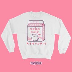 Shipping delays are possible. I can still create your order right away but I can no longer guarantee shipping times.Please feel free to message me if you have any questions.A soft but sturdy sweatshirt with a cute carton of pink kitty cat milk.This sweater looks great on both men and women. Perfect for people who love kawaii clothing and being cozy.Runs large for women, order your regular size for an oversized look, order a size down for a more fitted look.Fits men true to size. Plus sizes avail Pink Hello Kitty Print Crew Neck Sweatshirt, Pink Long Sleeve Top With Cat Design, Pink Long Sleeve Tops With Cat Design, Kawaii Crew Neck Sweater, Cute Cotton Sweatshirt With Cat Design, Cute Crew Neck Sweatshirt With Cat Design, Hello Kitty Cotton Sweatshirt In Kawaii Style, Pink Kawaii Crew Neck Sweatshirt, Cute Hello Kitty Print Crew Neck Sweatshirt