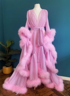 Beautiful chiffon dressing gown in Baby Pink.  Trimmed along the hem and the sleeve edges with fluffy marabou feathers.  Ties around the waist with a matching chiffon belt.  One size fits all due to the design and fullness of the robe.  Perfect for family gatherings, walking the dogs as well as taking out the rubbish.  Please expect some feathers to shed - no one can look this fabulous without losing a few feathers. Magenta Aesthetic Outfit, Fluffy Nightgown, Pink Feather Robe, Pink Fluffy Robe, Marabou Robe, Pink Vintage Dress, Pink Silk Robe, Pink Dressing Gown, Walking The Dogs