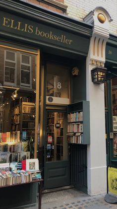 the outside of a bookstore with many books on display