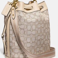 This Is A New Coach Bucket Bag 2 Way. 11”W 10h.Fabric Monogram With Leather Trim .Leather Top Handle With Adjustable Crossbody Strap.Hardware Is Gold.Comes With Dustbag Beige Monogram Canvas Satchel Bag, Elegant Monogram Canvas Bucket Bag For Daily Use, Chic Monogram Canvas Satchel With Detachable Strap, Chic Monogram Canvas Satchel With Dust Bag, Chic Monogram Canvas Satchel For Errands, Elegant Monogram Canvas Bucket Bag With Detachable Handle, Chic Monogram Canvas Bags, Beige Monogram Canvas Satchel With Detachable Strap, Beige Monogram Canvas Crossbody Satchel