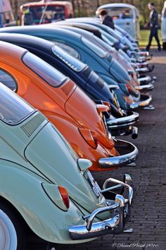 an assortment of old cars are lined up