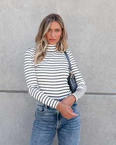 This Cream and Black Striped Turtleneck is a versatile addition to any wardrobe. With its long sleeves and soft, stretchy material, it offers both style and comfort. The classic cream and black stripes add a touch of sophistication to any outfit. Perfect for any fall occasion, and is great for layering! Simply style it with your favorite jeans along with some ankle booties and a matching crossbody bag for an elevated chic look! Black And White Striped Turtleneck Outfit, Classic Button-up Tops With Vertical Stripes, Fitted Button-up Blouse With Vertical Stripes, Cream And Black Striped Sweater, Striped Stretch Turtleneck Top, Sorority Rush Outfits, Rush Outfits, Loungewear Dresses, Gameday Dress