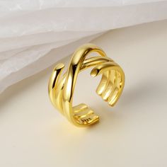 This Multi-Layer Wrap Around Crossed Band Ring is the perfect accessory to make a bold statement. With its sophisticated design, this ring is made from durable materials to provide a secure and comfortable fit. A stylish ring made with fashion in mind. Product Details Material: 925 Silver Color: 18K Gold/White Gold Plated Size: US Opening size 6.25 (adjustable size 5.5-7.5) Weight: about 7-7.2g SKU: AR23100720-G/AR23100720-W Product Keywords: Distorted band rings, Avante-garde rings, Unique shap Modern Gold Wide Band Open Ring, Trendy Gold Open Band Rings, Adjustable Gold Wide Band Open Ring, Gold Wide Band Ring With Modern Twist, Gold Wide Band Open Ring, Gold Rings With Modern Twist And Wide Band, Adjustable Gold Wide Band Ring With Open Shape, Adjustable Wide Band Open Ring In Gold, Adjustable Open Band Wide Gold Ring