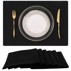 black placemats with gold trim and white plates