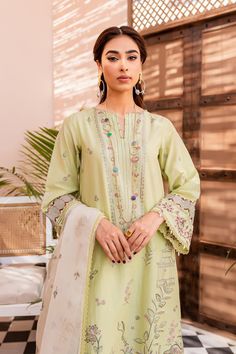 Pakistani Eid Dress in Green Lawn Kameez Trouser Style is a stunning attire adorned with embroidery work. The premium quality of lawn and hand-crafted embellishments make this perfectly stitched Pakistani Dress an epitome of beauty and your foremost priority. Detailed Description: SKU: PS1839 Detailing: Embroidery, Threads, Floral designs Color: Green Fabric: Organza, Lawn Design: Fully Embroidered dress Event: Festive, Party wear