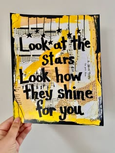 someone holding up a piece of art that reads look at the star, look how they shine for you