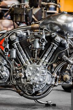 an old motorcycle is parked in a garage