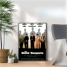 the usual suspect movie poster on a wall next to a chair and potted plant