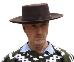 PRICES MAY VARY. Brown Wool Comes in Sizes 7 1/8, 7 1/4, 7 3/8, 7 5/8 Leather Hatband Professional Grade Stitching Shapeable Hat Brim Age range description: Adult This Wool hat looks very similar to the one Clint Eastwood wore in; "A FISTFUL OF DOLLARS", "FOR A FEW DOLLARS MORE", and "THE GOOD, THE BAD, and THE UGLY". Hand-tooled leather hatband on this hat is the same as the one on Eastwood's hat. Hat can easily be shaped -- Width of the brim is 3 1/4" and the crown height is 4" Casual Short Brim Felt Hat For Country Events, Casual Felt Hat With Short Brim For Country Events, Fitted Casual Felt Hat Flat Cap, Fitted Casual Felt Flat Cap, Casual Flat Brim Top Hat For Rodeo, Western Style Adjustable Flat Cap, Adjustable Western Style Flat Cap, Casual Brimmed Felt Hat For Country Events, Casual Winter Hats For Country Events