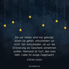 stars hanging from strings with german text on the bottom right corner and in the middle