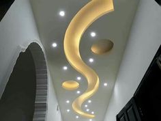 the ceiling is decorated with white and yellow lights