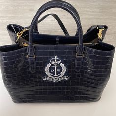 Ralph Lauren Navy Blue Logo Hand Shoulder Tote Bag Purse. $475. Gorgeous! Adjustable And Removable Shoulder Strap For Versatility. Length: 14.5” . Height: 11”. Depth: 7”. Logo Hand, Ralph Lauren Bags, Hand Logo, Tote Bag Purse, Blue Logo, Shoulder Tote Bag, Shoulder Tote, Shoulder Strap, Bag Lady