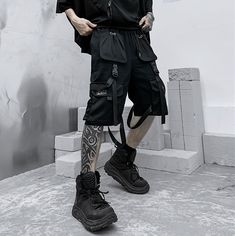 Master the concrete Jungle with our techwear shorts: when style meets performance. Discover our new streetwear shorts – the epitome of city-life fashion. Merging the thrilling world of tech clothing with the convenience of everyday apparel, these shorts reflect a unique symphony of style and function. Designed for the modern urbanite, these black techwear shorts features multiple front pockets, buckles, and straps, adding rich texture and a sophisticated tactical aura to your outfit, guaranteed to attract attention and keep rivals at bay. On a balmy summer night, when the city calls you to roam its shadowy streets, our shorts promise comfort and an unforgettable cyber ninja style. Wave goodbye to the day's stifling heat and embrace the cool, nocturnal breeze. The city streets are your runw Techwear Cargo Pants With Built-in Shorts For Streetwear, Techwear Cargo Shorts With Cargo Pockets, Techwear Cargo Shorts With Multiple Pockets, Utility Cargo Shorts With Multiple Pockets For Streetwear, Utility Style Cargo Shorts With Multiple Pockets, Urban Cargo Shorts With Multiple Pockets, Techwear Cargo Shorts With Functional Pockets For Outdoor, Techwear Cargo Shorts With Functional Pockets For Outdoor Activities, Black Cargo Style Shorts For Outdoor Activities