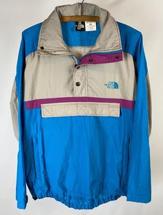 Vintage color block North Face half-zip windbreaker with double front pockets and roll away hood.  Hidden zipper pouch on front and back. Size: XS Fall Color Block Windbreaker For Outdoor Activities, Long Sleeve Color Block Windbreaker For Outdoor Activities, Casual Patchwork Windbreaker For Outdoor Activities, Casual Patchwork Windbreaker For Outdoor, Functional Long Sleeve Patchwork Windbreaker, 90s Windbreaker For Outdoor Activities, 90s Style Windbreaker For Outdoor Activities, 90s Style Long Sleeve Windbreaker For Outdoor Activities, 90s Style Long Sleeve Windbreaker For Outdoor