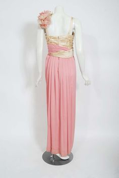 For Sale on 1stDibs - A breathtaking pale-pink silk and ivory satin custom-made 20th Century Fox gown dating back to the early 1960's. Though I am unsure of which production Silk Evening Gown With Boned Bodice, Silk Gown With Boned Bodice For Evening, Silk Cream Evening Dress With Fitted Bodice, Pink Pre-draped Silk Evening Dress, Formal Pink Evening Dress With Boned Bodice, Pink Silk Evening Dress With Pleated Bodice, Cream Silk Party Gown, Silk Pink Dress For Banquet, Pink Silk Gown With Pleated Bodice