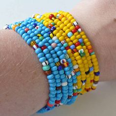 So wonderful to look at! This is a set of 5 brightly colored rainbow seed bead bracelets. Each light weight, strong, stretchy. Easy to wear. Can be made to fit you perfectly in child through adult sizes. Beads may vary slightly from the ones shown. Pictures show other color options available. Purchasing this listing, you will get 5 strands of seed bead bracelets as seen in the 1st picture. This is a special NON personalized price. This listing is for 1 set of 5 bracelets all the same size. The s Yellow Turquoise, Rainbow Kids, Colorful Rainbow, Bead Bracelets, Seed Bead Bracelets, Organza Bags, Bracelet Stack, Seed Bead, Other Colors